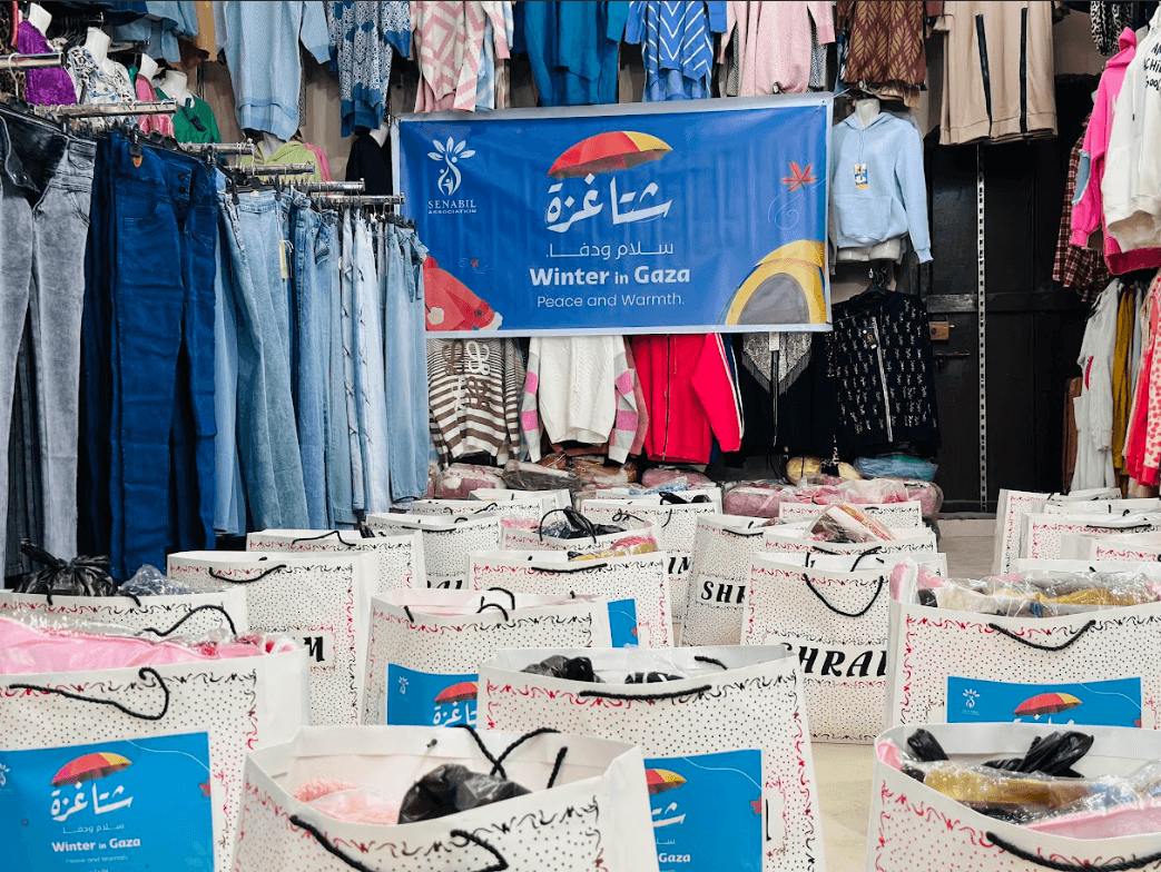 Distribution of Winter Clothing for Women in Displacement Camps under the “Gaza Winter… Peace & Warmth” Campaign