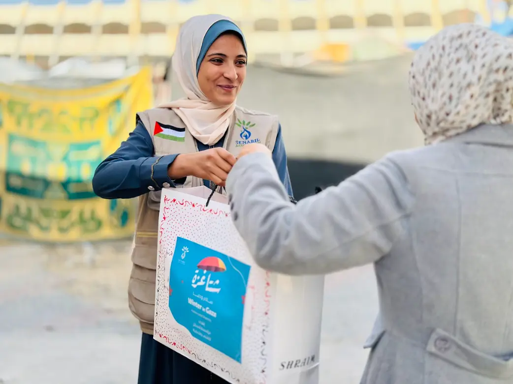 Distribution of Winter Clothing for Women in Displacement Camps under the “Gaza Winter… Peace & Warmth” Campaign