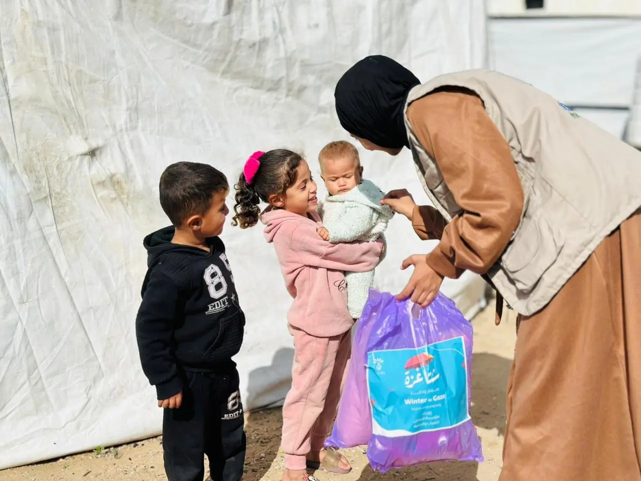 Distribution of Winter Clothing Kits for Infants under the “Gaza Winter… Peace &amp; Warmth” Campaign